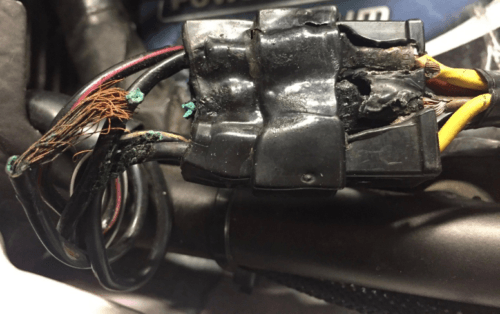 Damage to connector between regulator rectifier and stator, caused by faulty motorcycle charging system